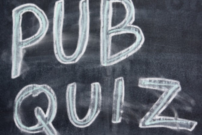 Pub quiz written on chalkboard