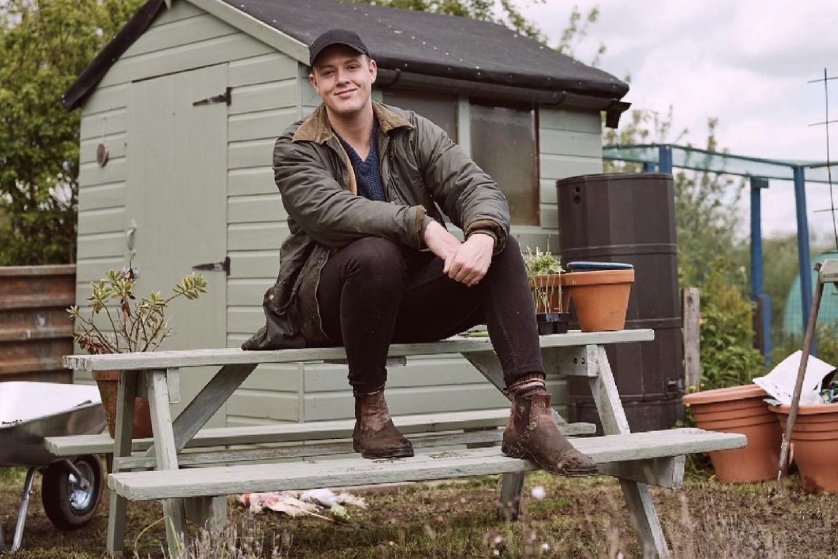 Tom sitting on his allotment