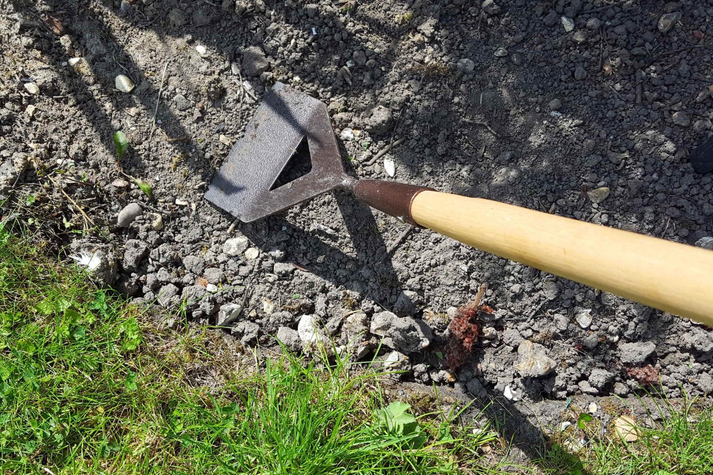 A hoe used for weeding and sowing