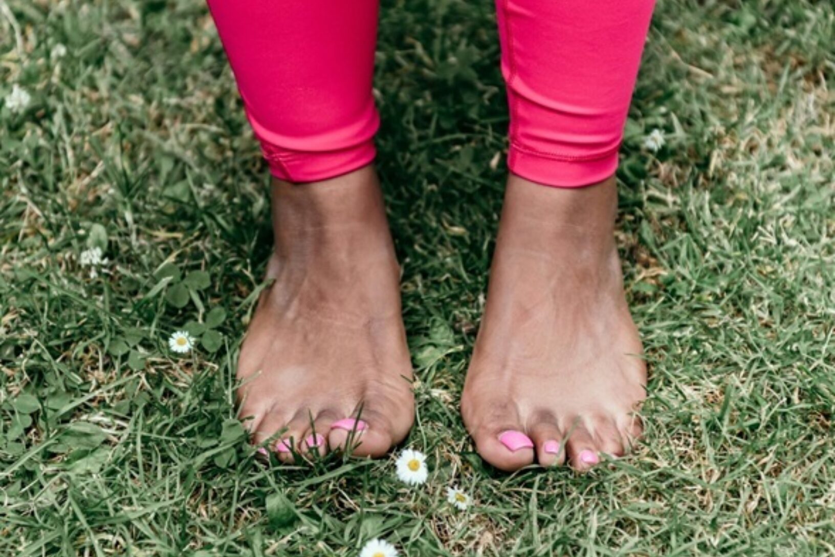 Barefoot feet on grass