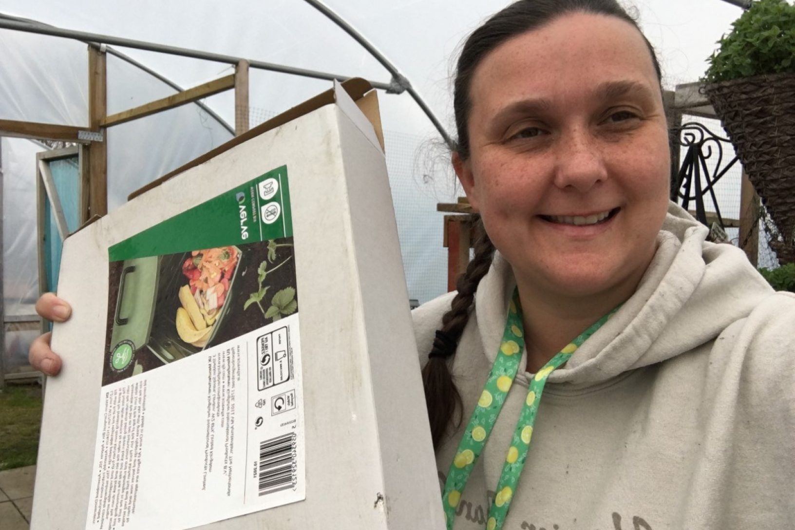 Nikki holding a worm composter