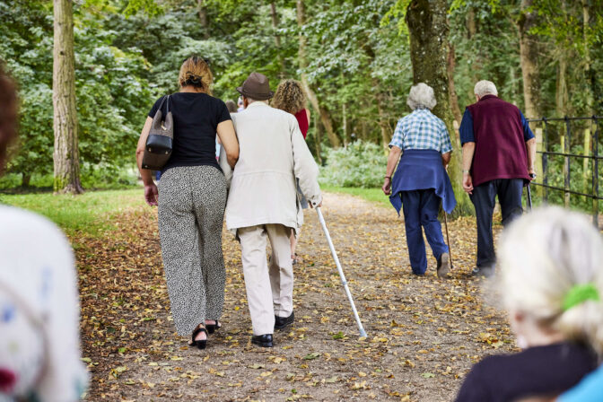 Photo Carers taking a walk with the people they care for Credit Carers UK